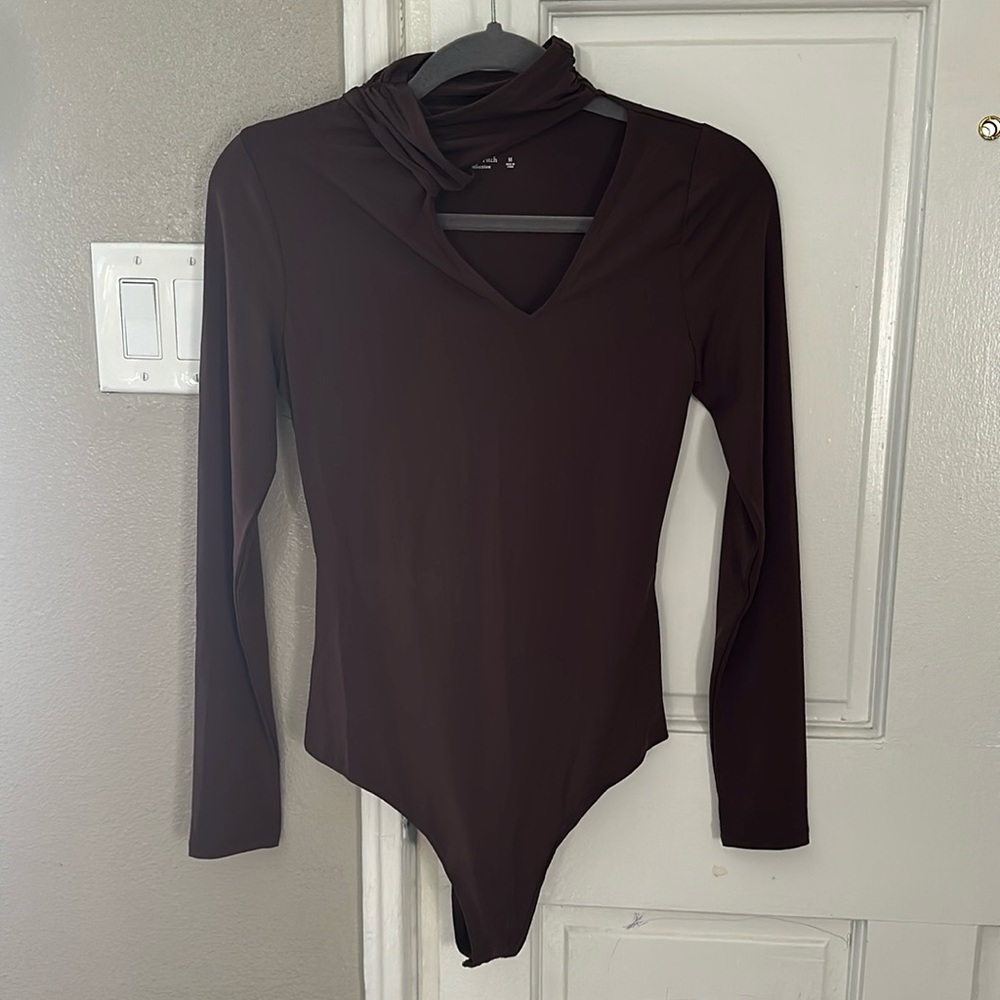 Brown body suit